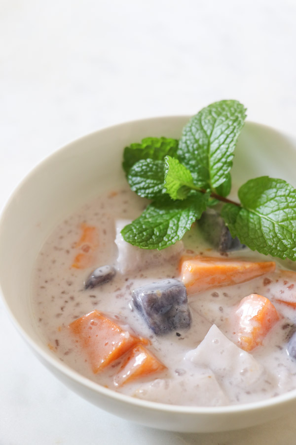 Looking for a healthy dessert/snack recipe? Try this easy and delicious sweet potato/taro root, coconut milk recipe for Ginataang. This Filipino treat is a FUN clean eating recipe to sneak healthy root vegetables into your diet. #recipe #healthy #healthyrecipes #cleaneating #vegan #vegetarian #desserts #dessertfoodrecipes