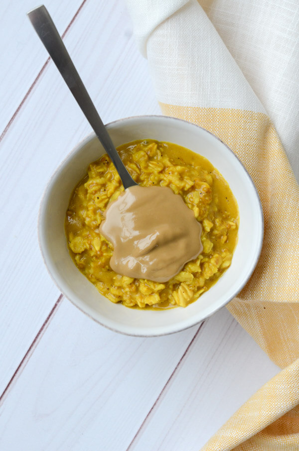 If you like Golden lattes, you'll love this Golden Oatmeal Recipe with Turmeric and Sunbutter. This anti-inflammatory clean eating recipe is easy and fast for a quick, delicious breakfast. #recipe #healthy #healthyrecipes #cleaneating #vegan #vegetarian #breakfast #breakfastfood