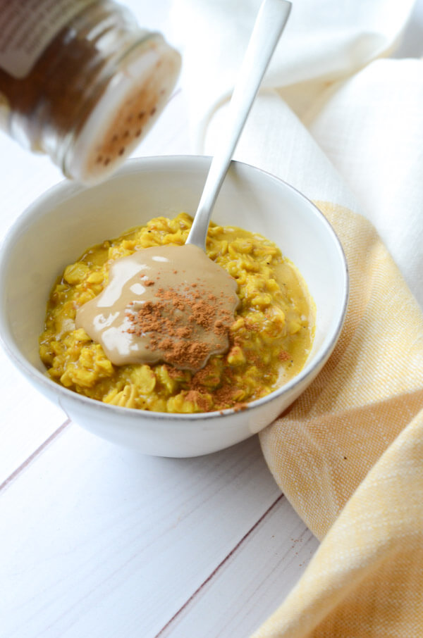 If you like Golden lattes, you'll love this Golden Oatmeal Recipe with Turmeric and Sunbutter. This anti-inflammatory clean eating recipe is easy and fast for a quick, delicious breakfast. #recipe #healthy #healthyrecipes #cleaneating #vegan #vegetarian #breakfast #breakfastfood