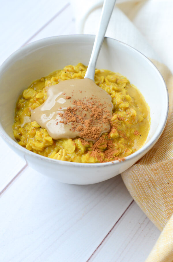 If you like Golden lattes, you'll love this Golden Oatmeal Recipe with Turmeric and Sunbutter. This anti-inflammatory clean eating recipe is easy and fast for a quick, delicious breakfast. #recipe #healthy #healthyrecipes #cleaneating #vegan #vegetarian #breakfast #breakfastfood