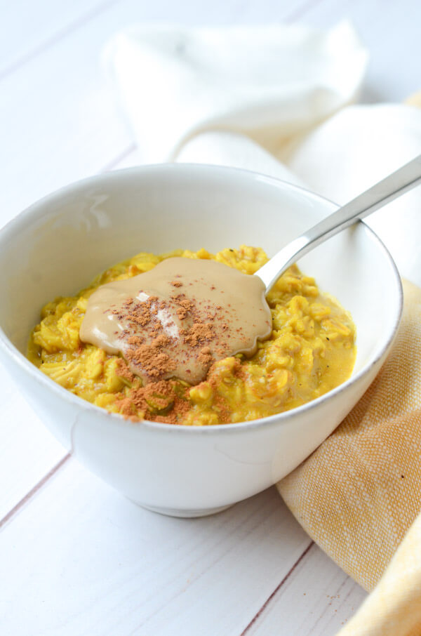 If you like Golden lattes, you'll love this Golden Oatmeal Recipe with Turmeric and Sunbutter. This anti-inflammatory clean eating recipe is easy and fast for a quick, delicious breakfast. #recipe #healthy #healthyrecipes #cleaneating #vegan #vegetarian #breakfast #breakfastfood