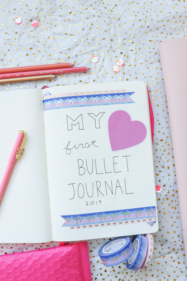 Here's a super EASY idea for a Bullet Journal title page for your first bullet journal. Make it look pretty without drawing by using washi tape and stickers. Click for supplies used #bulletjournal #bulletjournalideas #bujo #planner