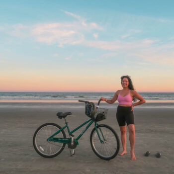 Diana at Kiawah Island Resort beach with a bicycle