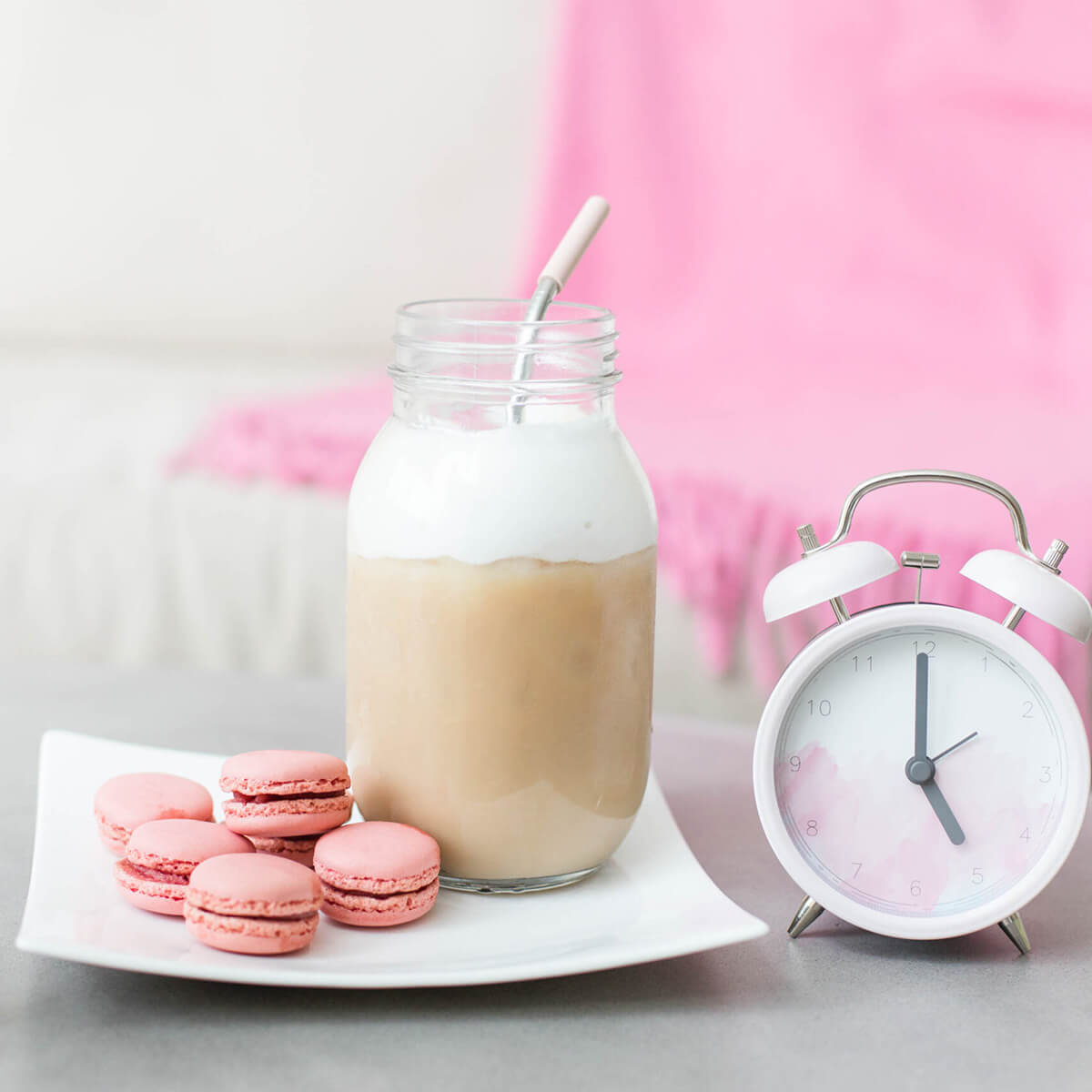 Coffee, macarons, clock