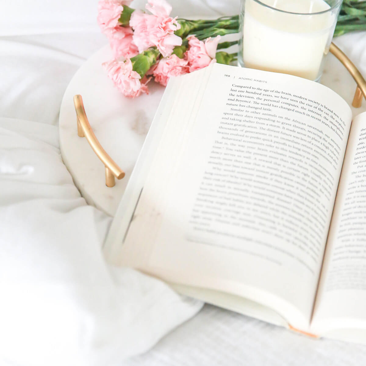 Flowers, candle, book