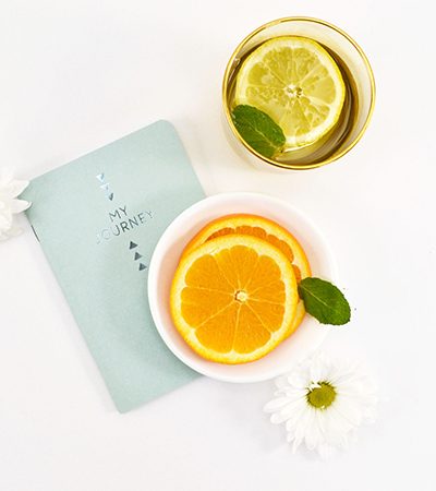 Journal and Drinks with Citrus