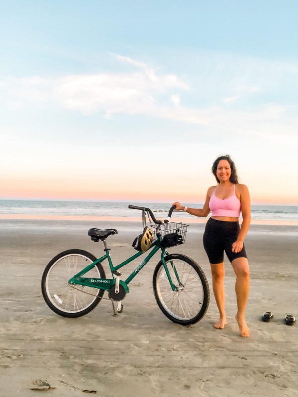 Diana with a bicycle on the beach